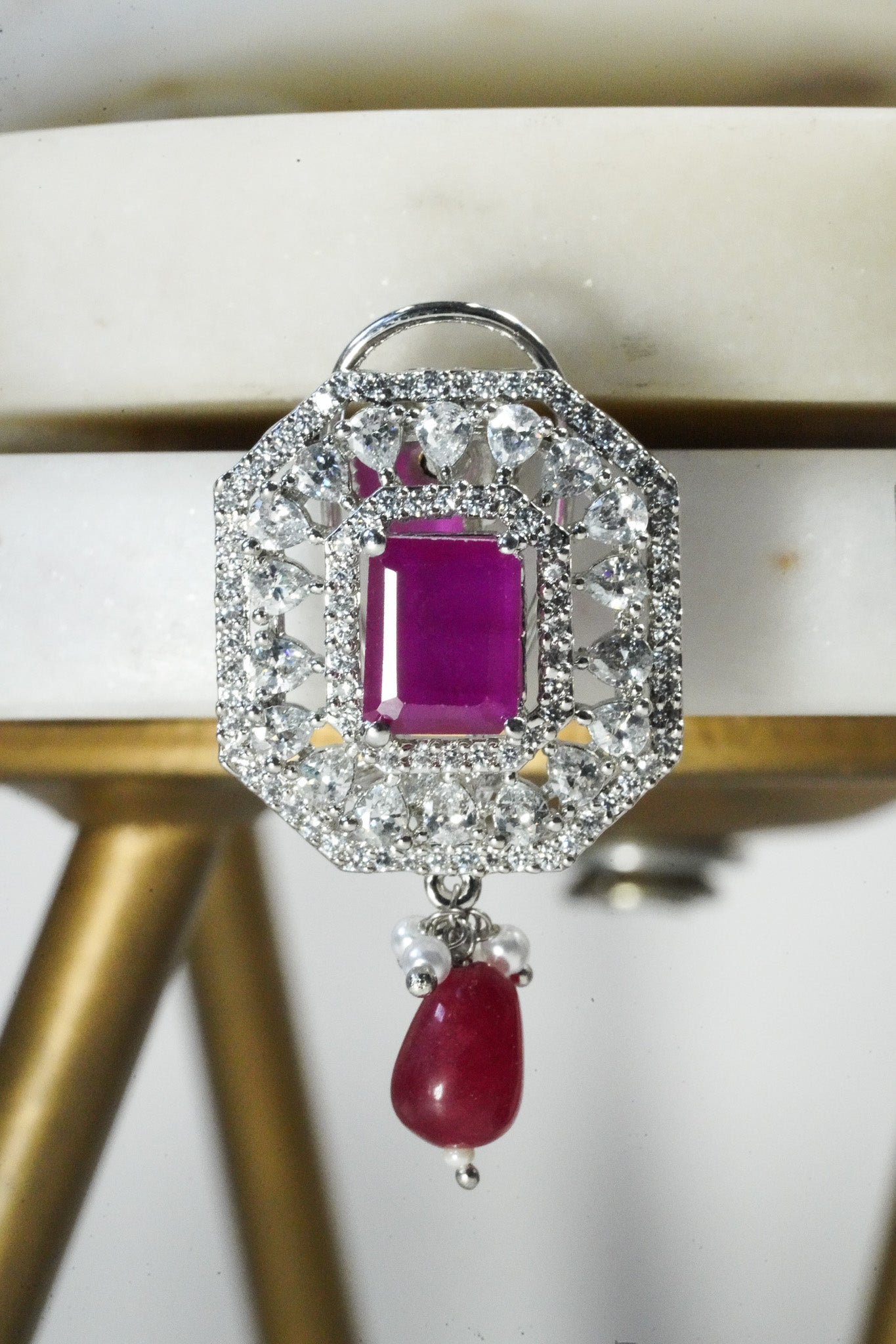 Jhanvi Choker Necklace Set - Silver & Gem Variations featuring cushion-cut AD stones with ruby teardrop accents, includes matching earrings.