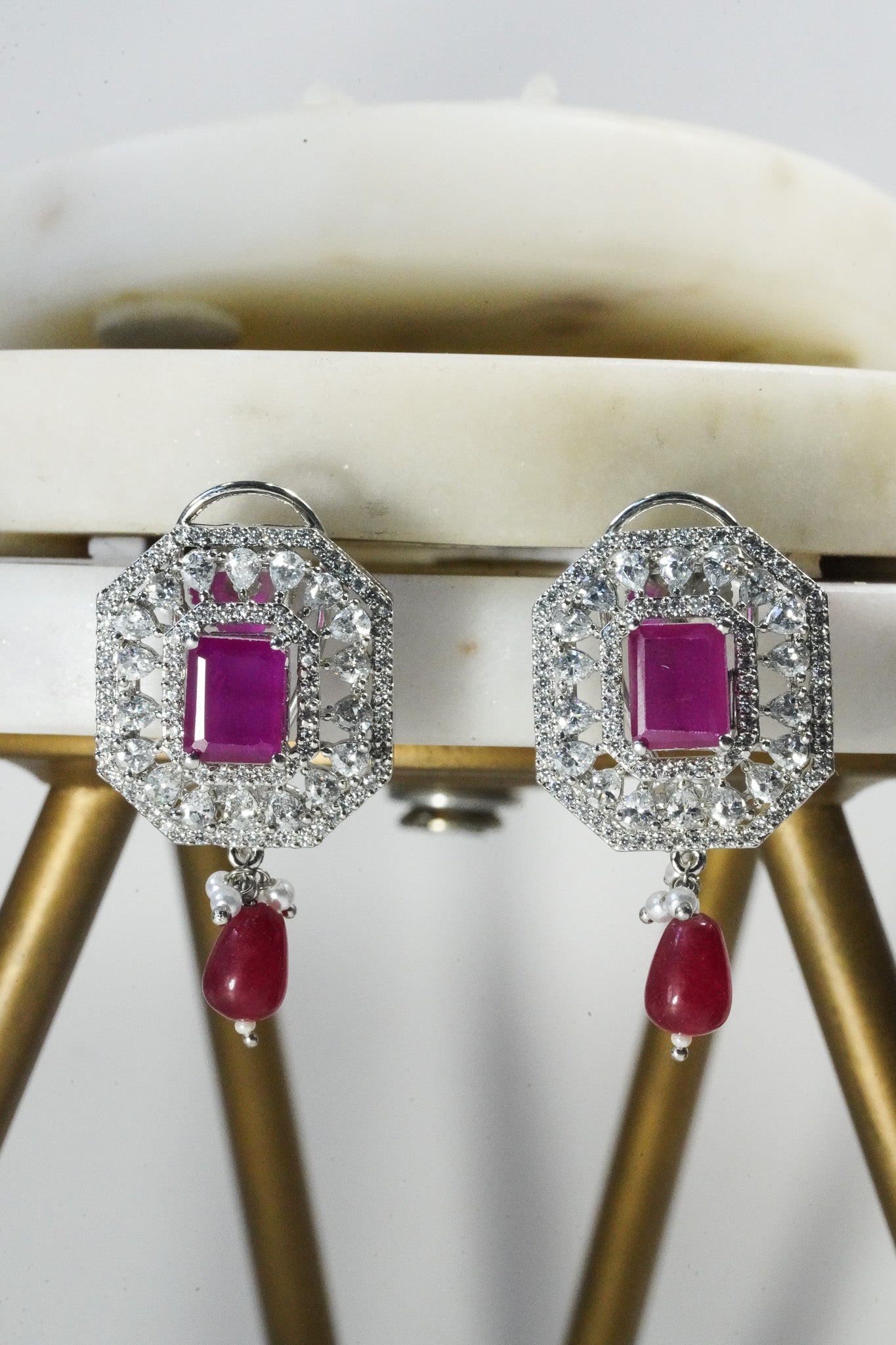 Jhanvi Choker Necklace Set - Silver & Gem Variations featuring cushion-cut AD stones with ruby teardrop accents, includes matching earrings.