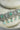 Jhanvi Choker Necklace Set - Silver & Gem Variations featuring cushion-cut AD stones with mint green teardrop accents, includes matching earrings.