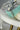 Jhanvi Choker Necklace Set - Silver & Gem Variations featuring cushion-cut AD stones with mint green teardrop accents, includes matching earrings.