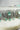 Jhanvi Choker Necklace Set - Silver & Gem Variations featuring cushion-cut AD stones with mint green teardrop accents, includes matching earrings.