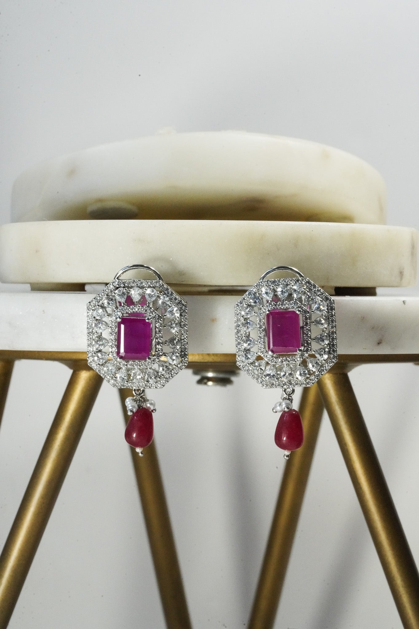 Jhanvi Choker Necklace Set - Silver & Gem Variations featuring cushion-cut AD stones with ruby teardrop accents, includes matching earrings.