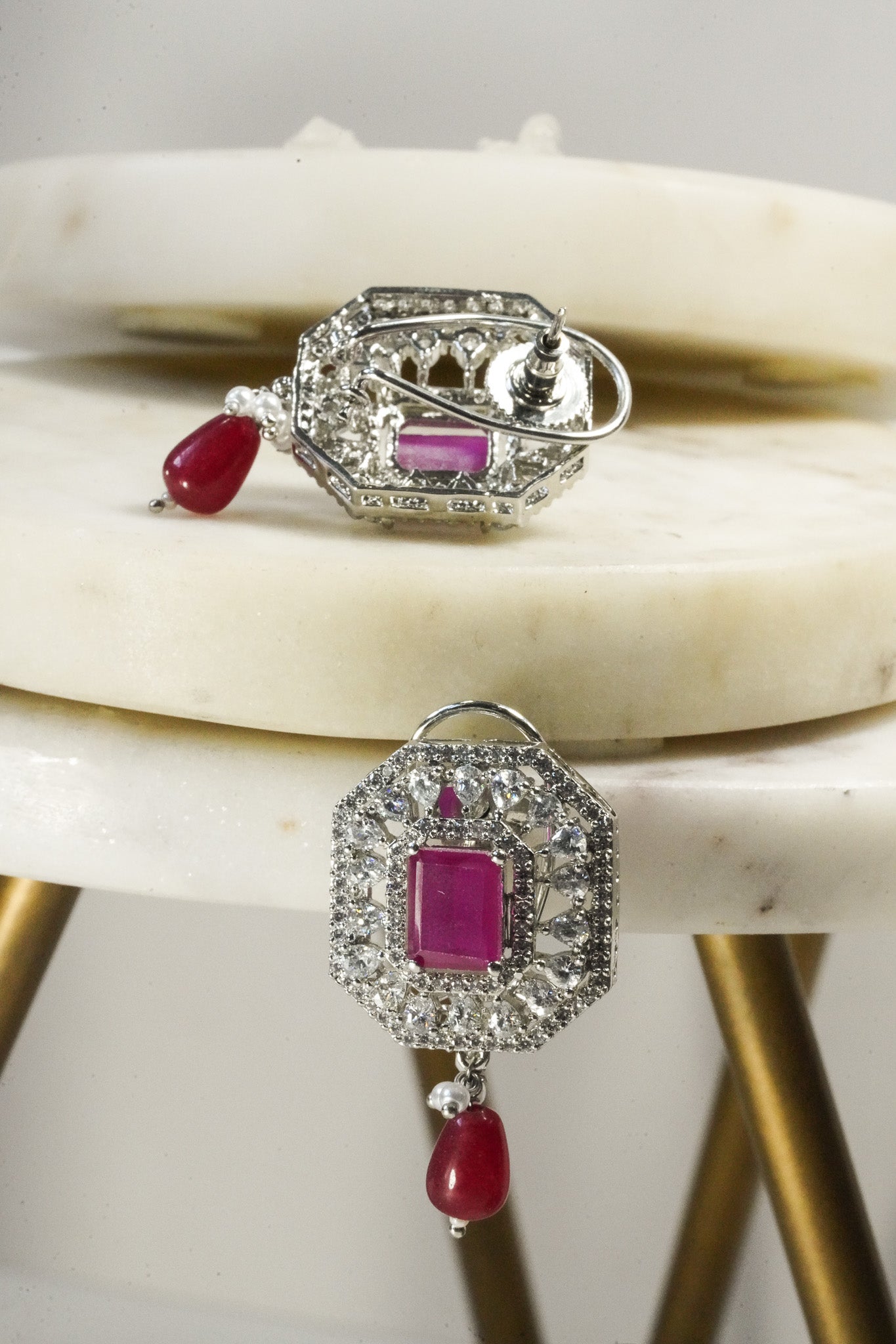Jhanvi Choker Necklace Set - Silver & Gem Variations featuring cushion-cut AD stones with ruby teardrop accents, includes matching earrings.