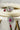 Jhanvi Choker Necklace Set - Silver & Gem Variations featuring cushion-cut AD stones with ruby teardrop accents, includes matching earrings.