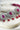 Jhanvi Choker Necklace Set - Silver & Gem Variations featuring cushion-cut AD stones with ruby teardrop accents, includes matching earrings.