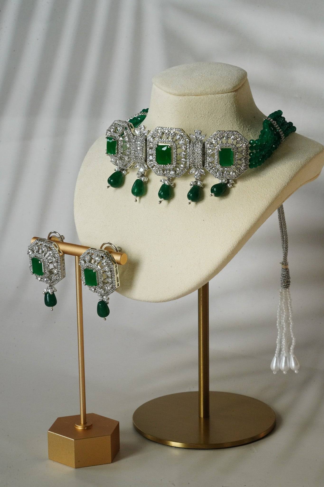 Jhanvi Choker Necklace Set - Silver & Gem Variations featuring cushion-cut AD stones with green teardrop accents, includes matching earrings.