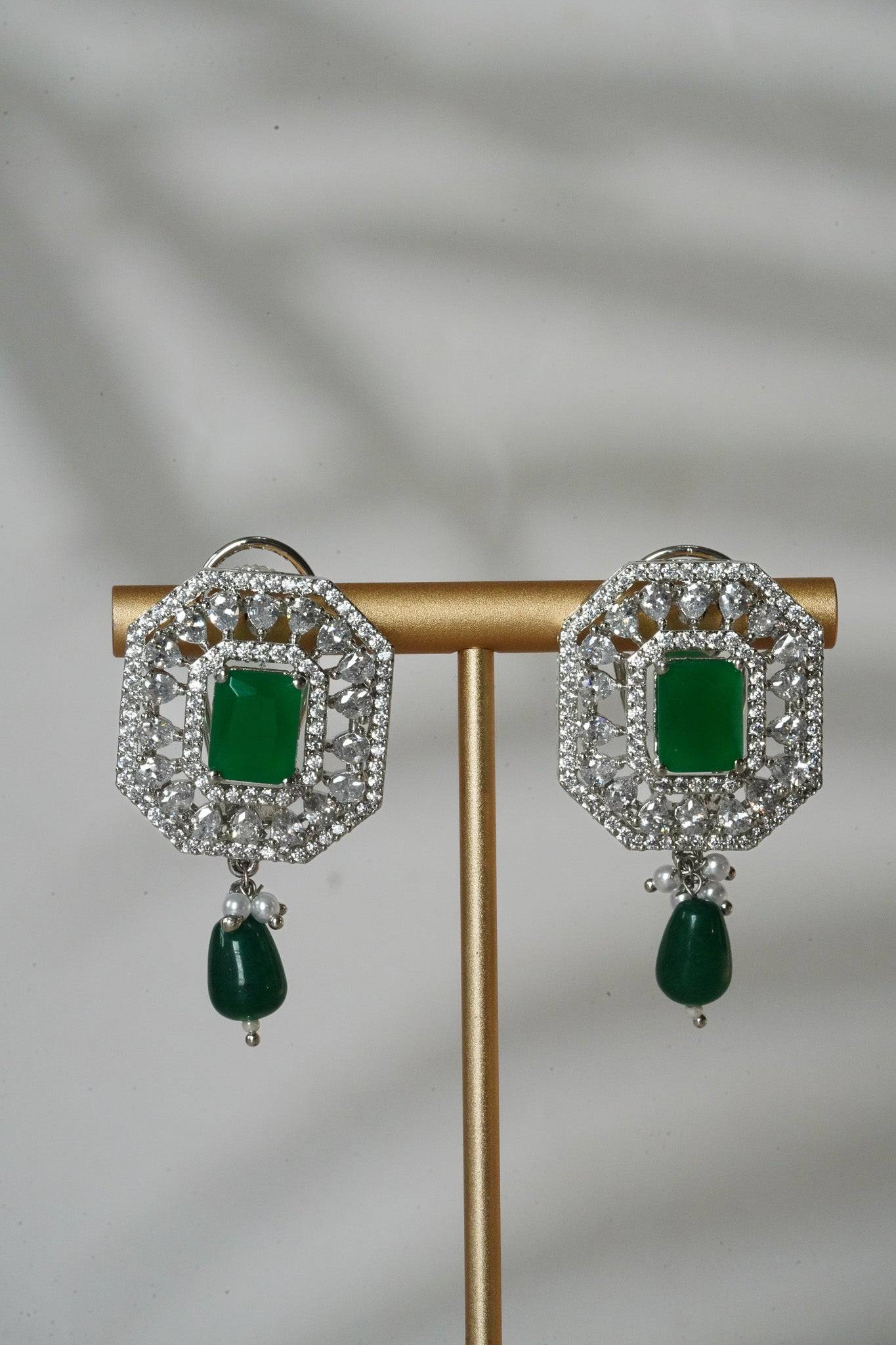 Jhanvi Choker Necklace Set - Silver & Gem Variations featuring cushion-cut AD stones with green teardrop accents, includes matching earrings.