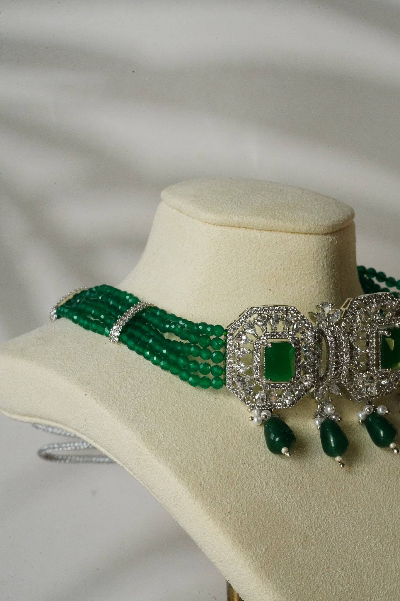 Jhanvi Choker Necklace Set - Silver & Gem Variations featuring cushion-cut AD stones with green teardrop accents, includes matching earrings.
