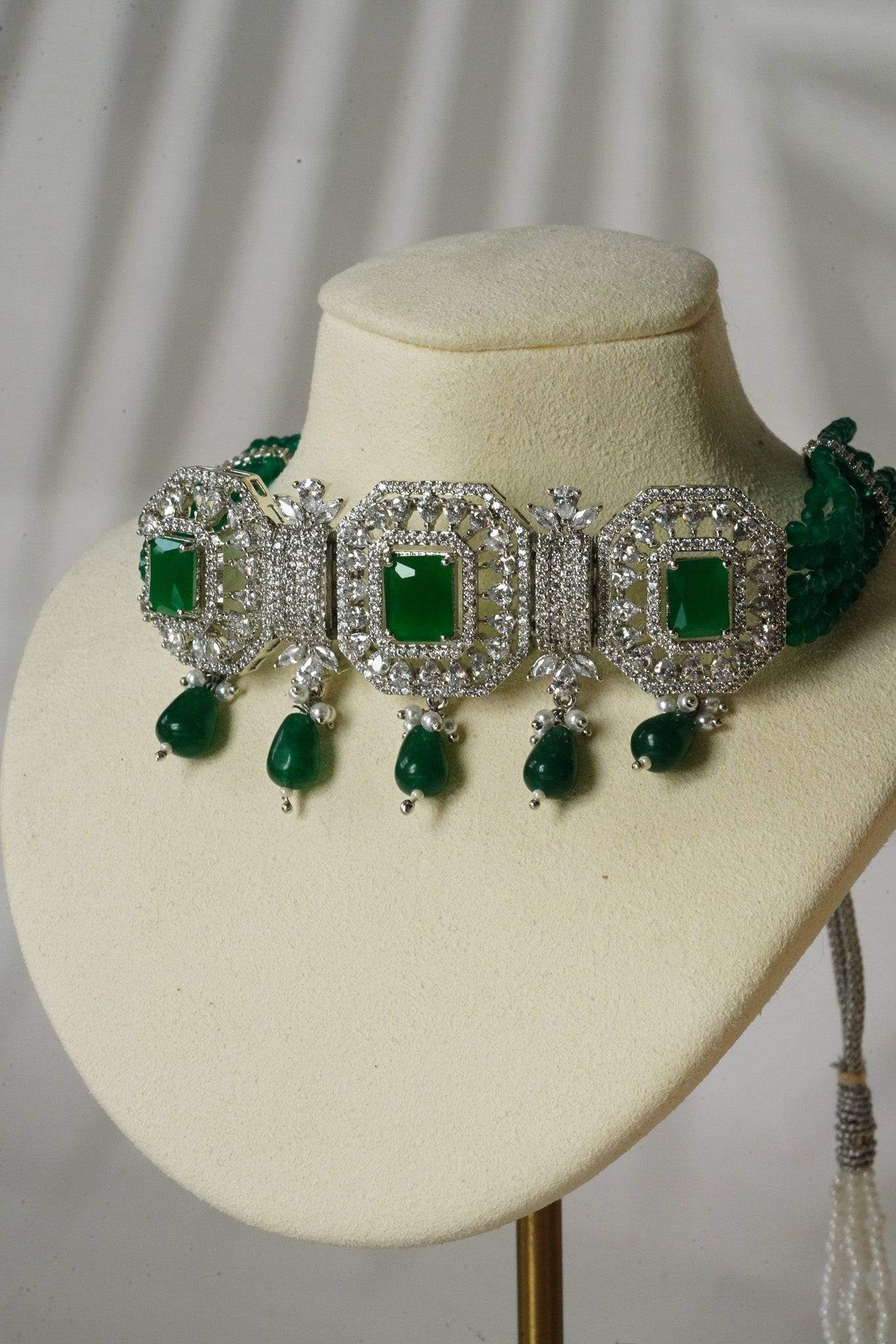 Jhanvi Choker Necklace Set - Silver & Gem Variations featuring cushion-cut AD stones with green teardrop accents, includes matching earrings.
