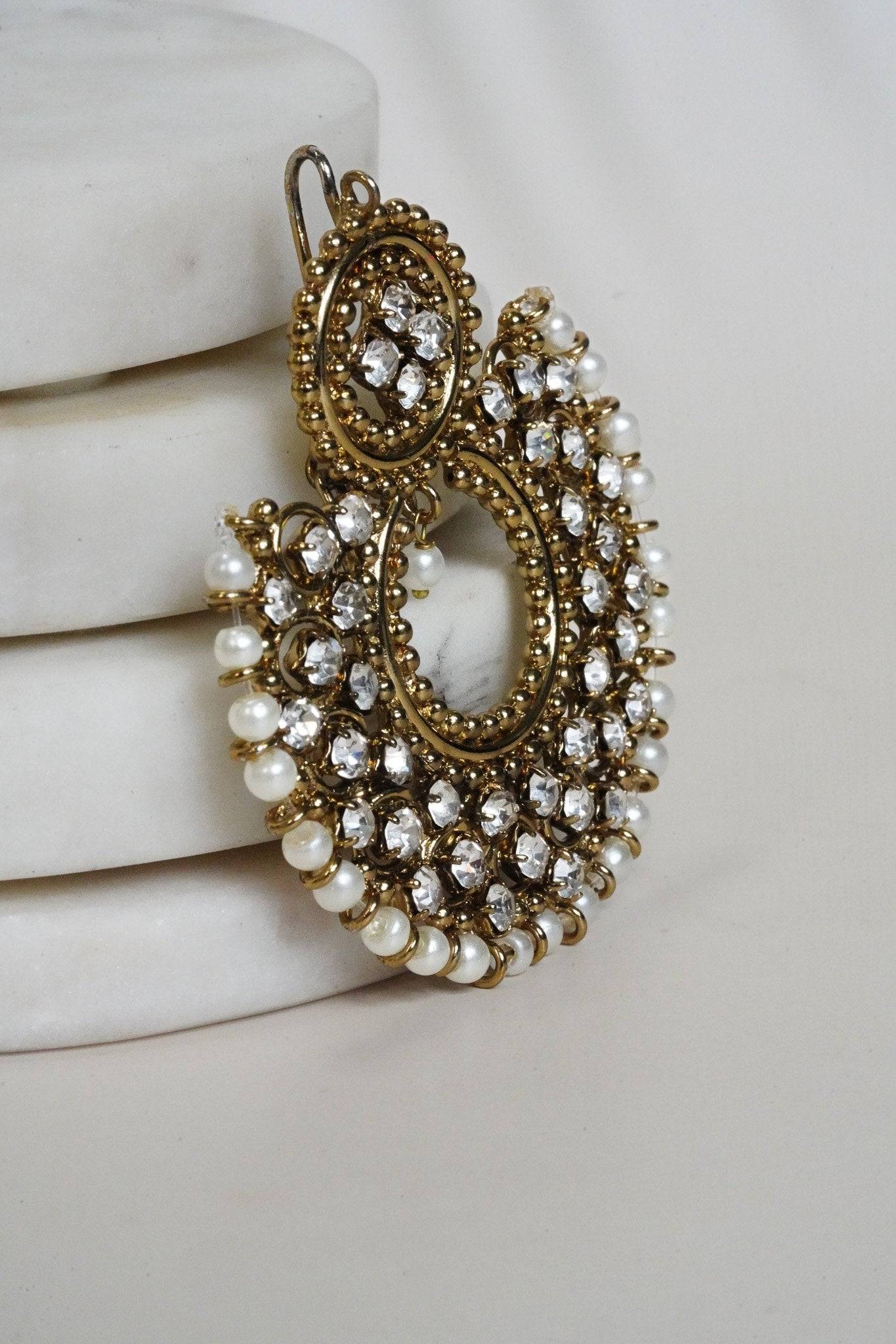 Angled view of Laila Chandbali Earring in antique gold with white stones and pearl border, perfect for festive styling.
