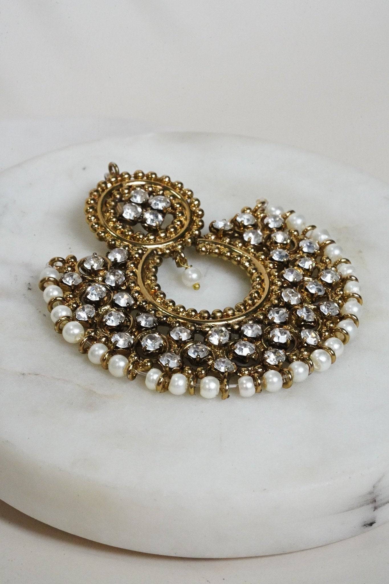 Side angle of Laila Chandbali Earring in antique gold with crystal embellishments and pearl detailing for ethnic wear.