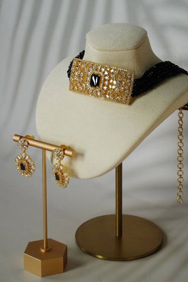 Close-up of Luna Chic Choker Set in black with rectangular gold-plated pendant and crystal accents, paired with dainty drop earrings.