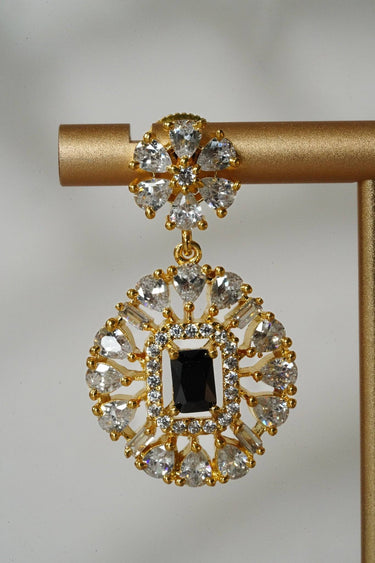 Detailed view of Luna Chic earring with black gemstone center and crystal halo, part of the chic gold-plated choker jewelry set.
