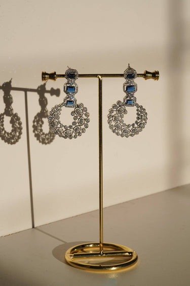 Mahi Asymmetrical Choker Necklace Set - Rhodium-plated with AD stones, available in silver & green, silver & ruby, and silver & sapphire blue, perfect for contemporary elegance.