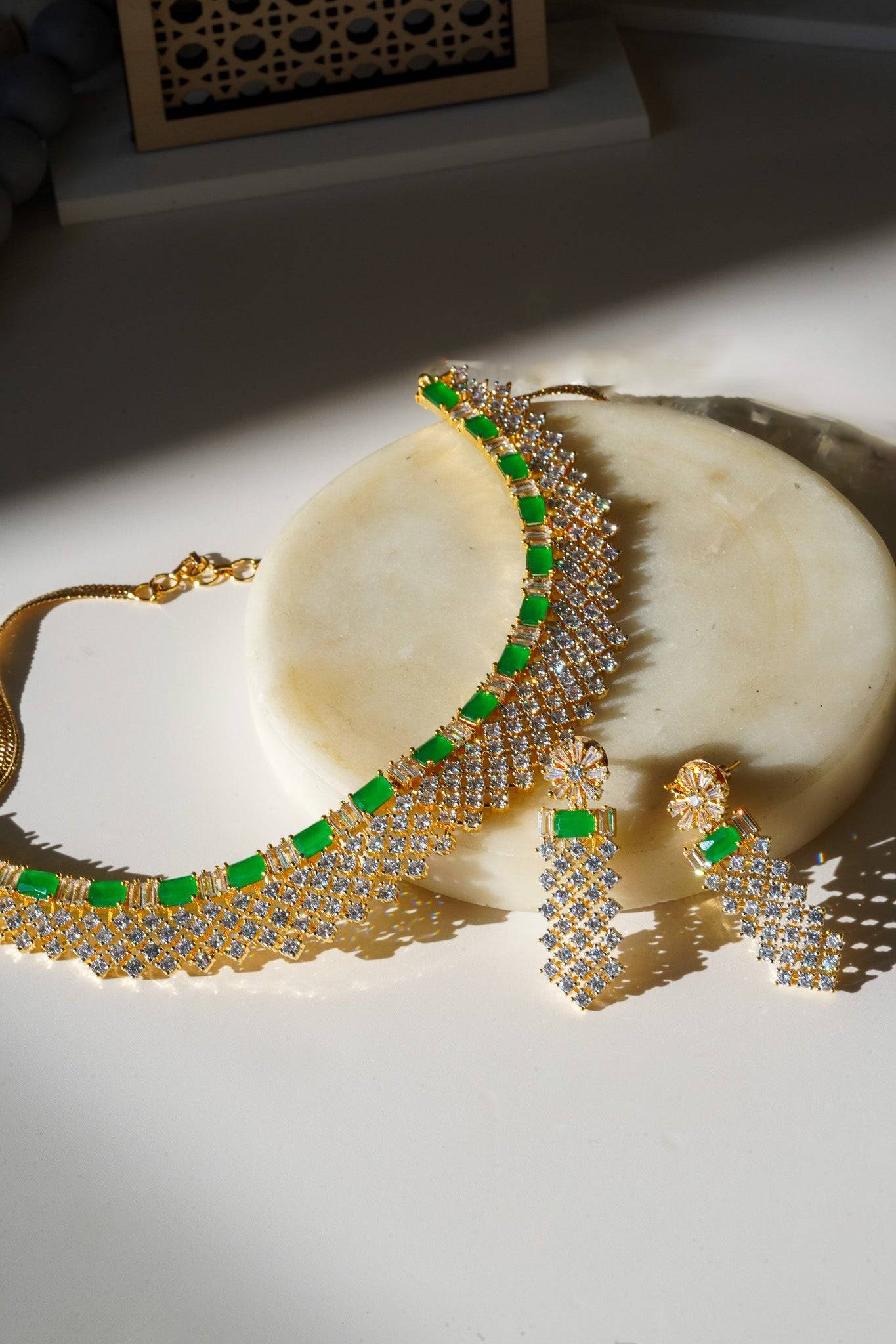 Meghna Diamante Necklace Set - High-quality brass with AD stones, available in gold & green, and gold & dusty pink, includes top-style earrings.
