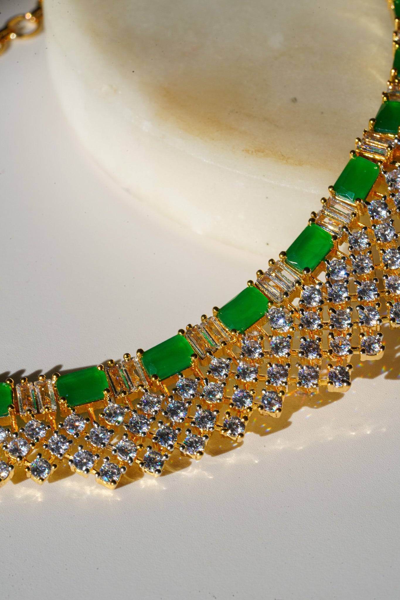 Meghna Diamante Necklace Set - High-quality brass with AD stones, available in gold & green, and gold & dusty pink, includes top-style earrings.