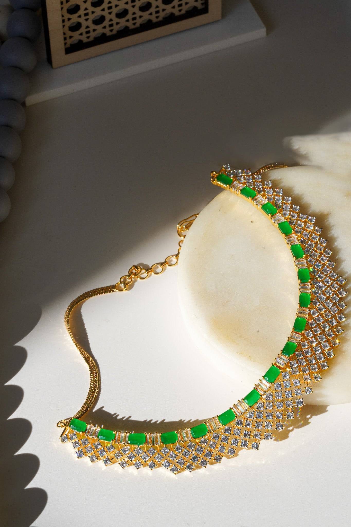 Meghna Diamante Necklace Set - High-quality brass with AD stones, available in gold & green, and gold & dusty pink, includes top-style earrings.