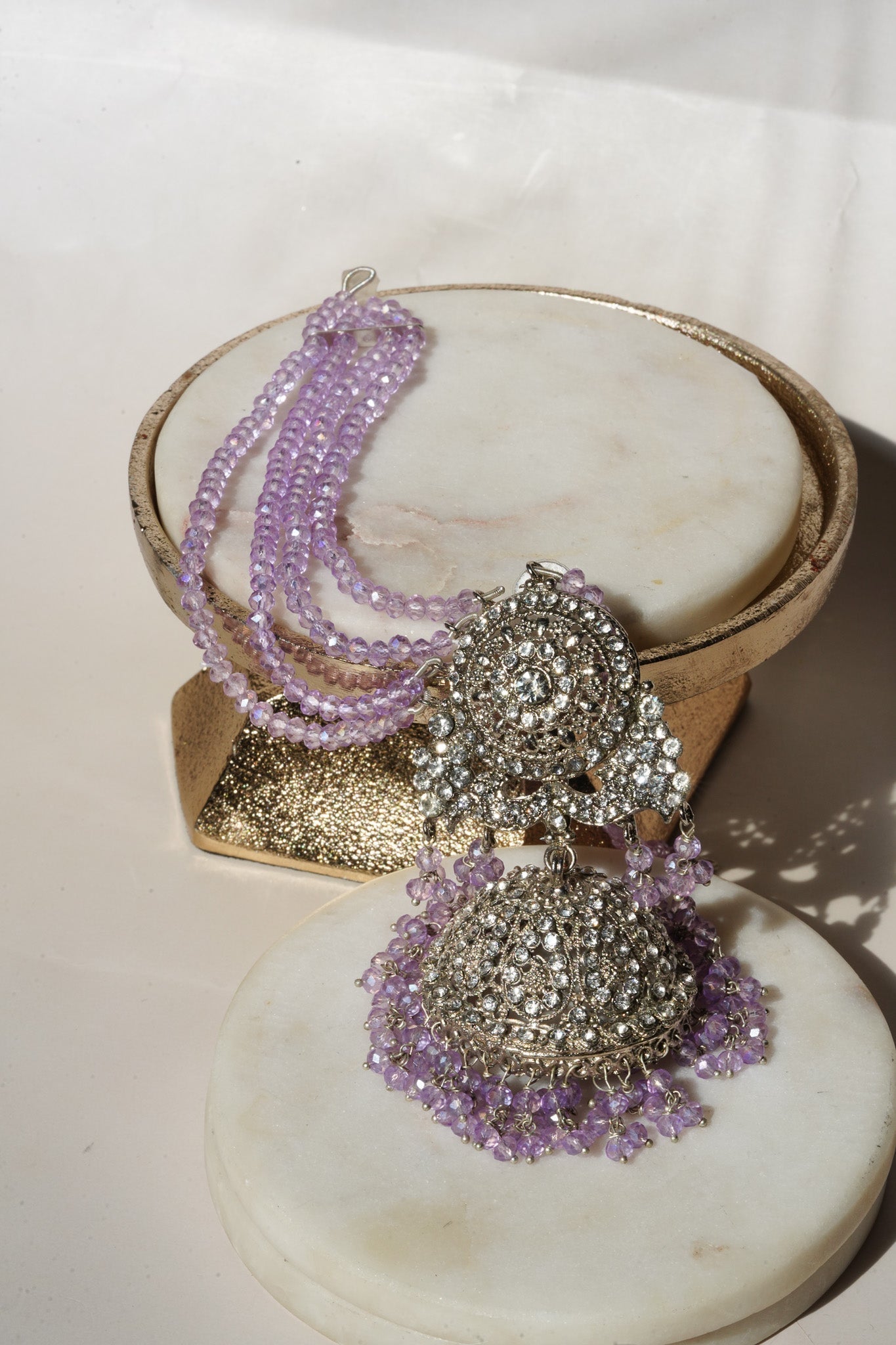 Lavender beaded earrings from Namar Choker Necklace Set displayed on marble base, ideal for Indian jewelry lovers.