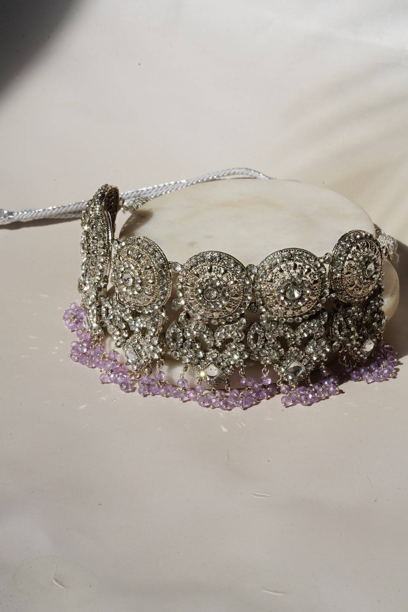 Side view of lavender beaded choker from Namar Necklace Set with silver CZ stone accents.