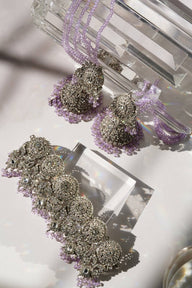 Flat lay of Namar Choker Necklace Set with lavender beads and CZ stones, ideal for Indian wedding jewelry collections.