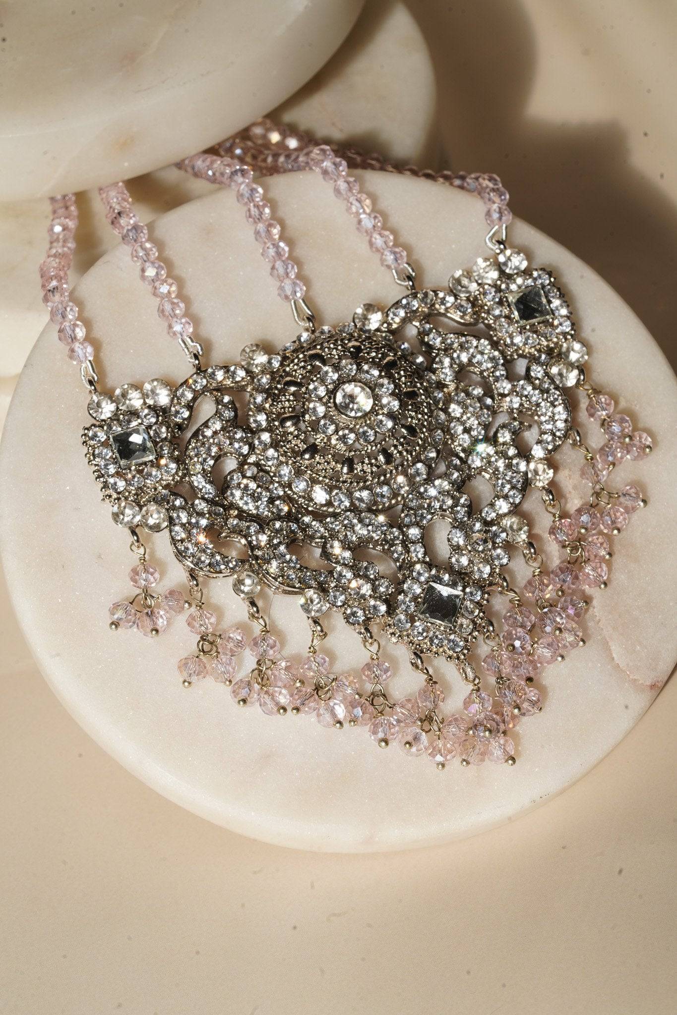 Detailed view of maang tikka from Namar Choker Necklace Set with pink beads and intricate silver CZ work.