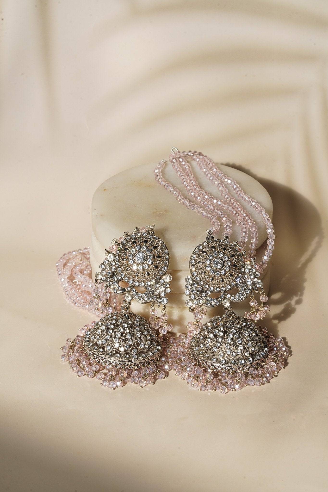 Earrings from Namar Silver Plated AD Indian Choker Necklace Set with light pink beads and CZ stones on marble base.