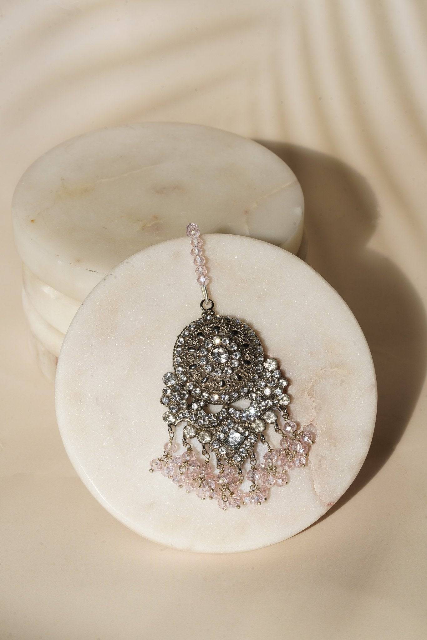 Single earring from Namar Silver Plated AD Indian Choker Necklace Set with pink beads and CZ embellishments.