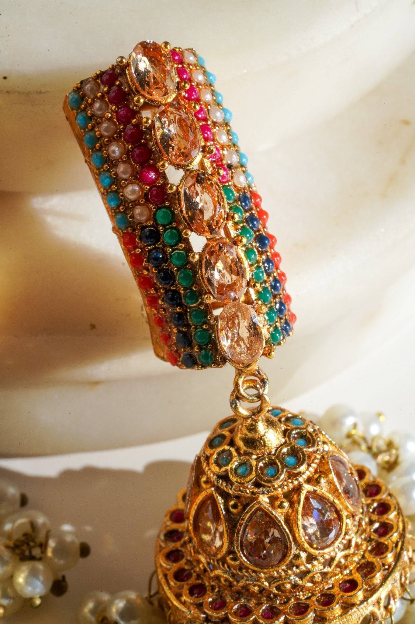 Navdeep Jhumka Earrings - Handcrafted with antique gold plating, available in ruby, blue, or gold, featuring multi-color stones and embellishments.