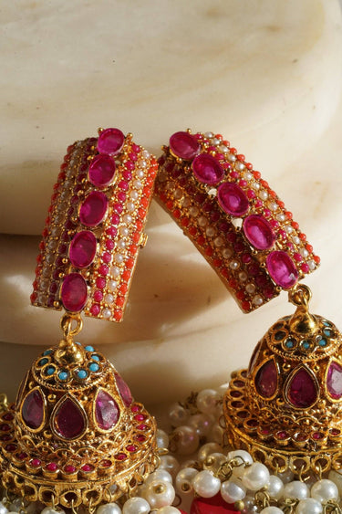 Navdeep Jhumka Earrings - Handcrafted with antique gold plating, available in ruby, blue, or gold, featuring multi-color stones and embellishments.