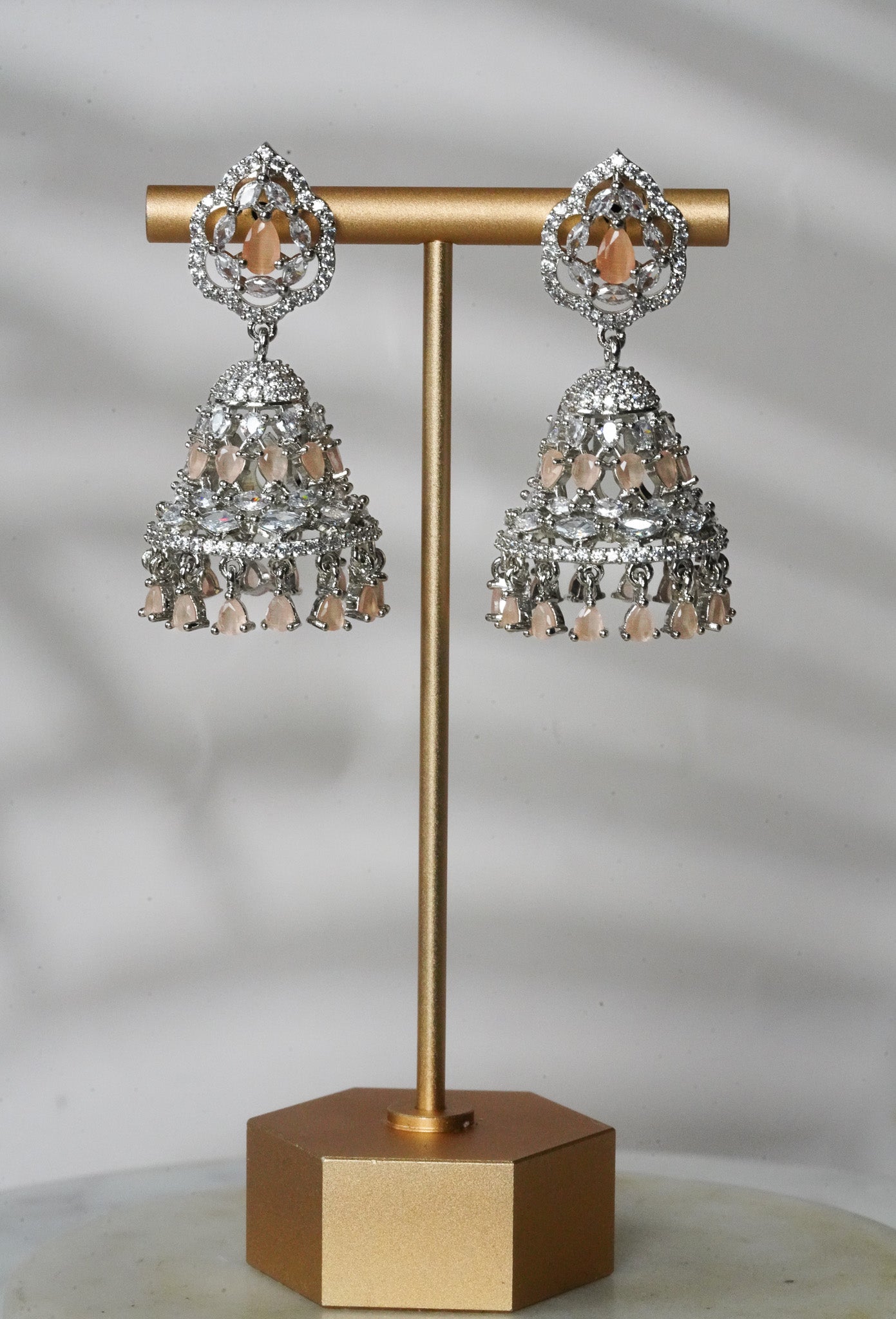 Pooja - Silver and Peach AD Jhumka and Mini Tikka Set Earrings & Tikka Set from Inaury