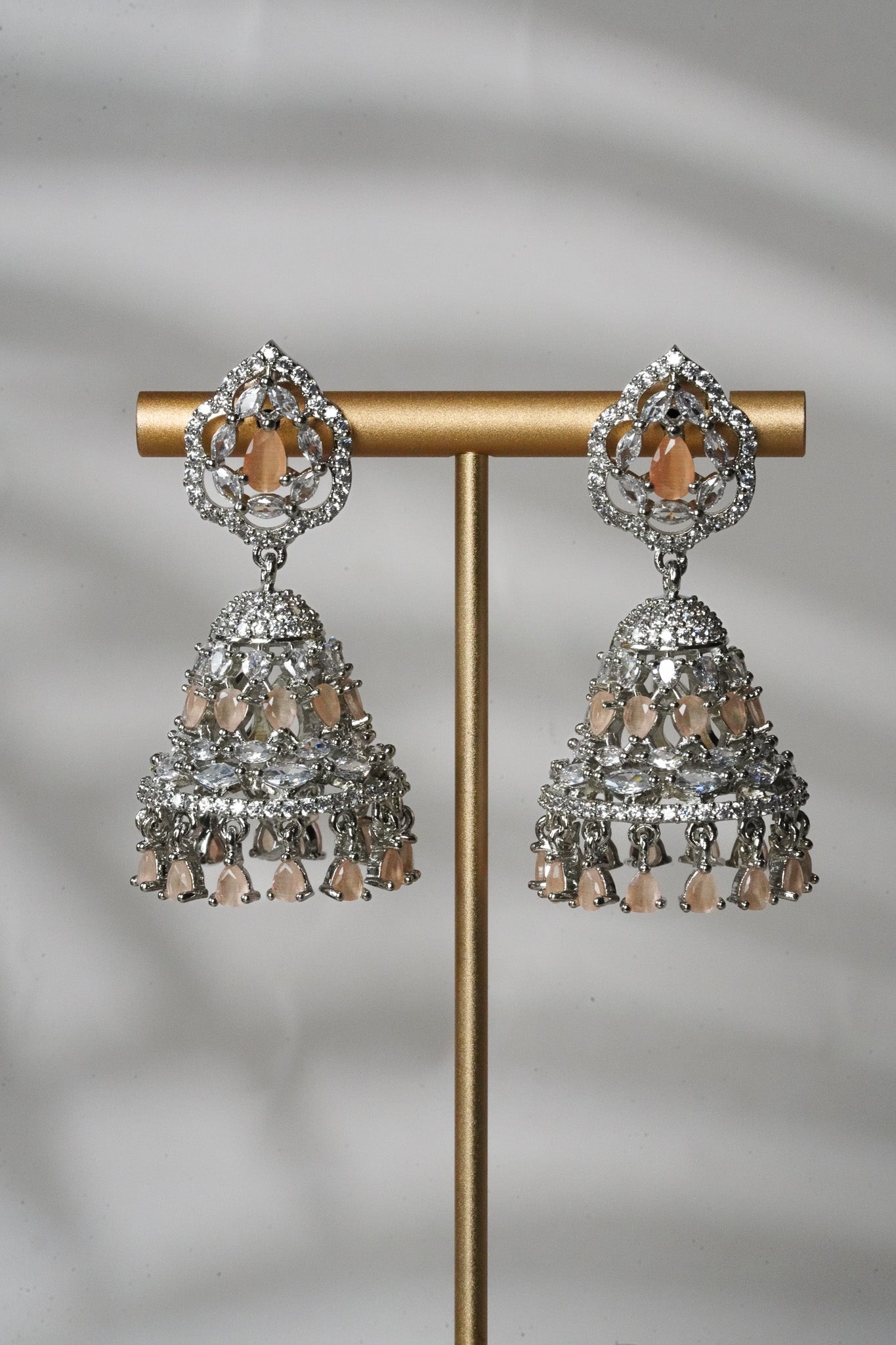 Pooja - Silver and Peach AD Jhumka and Mini Tikka Set Earrings & Tikka Set from Inaury