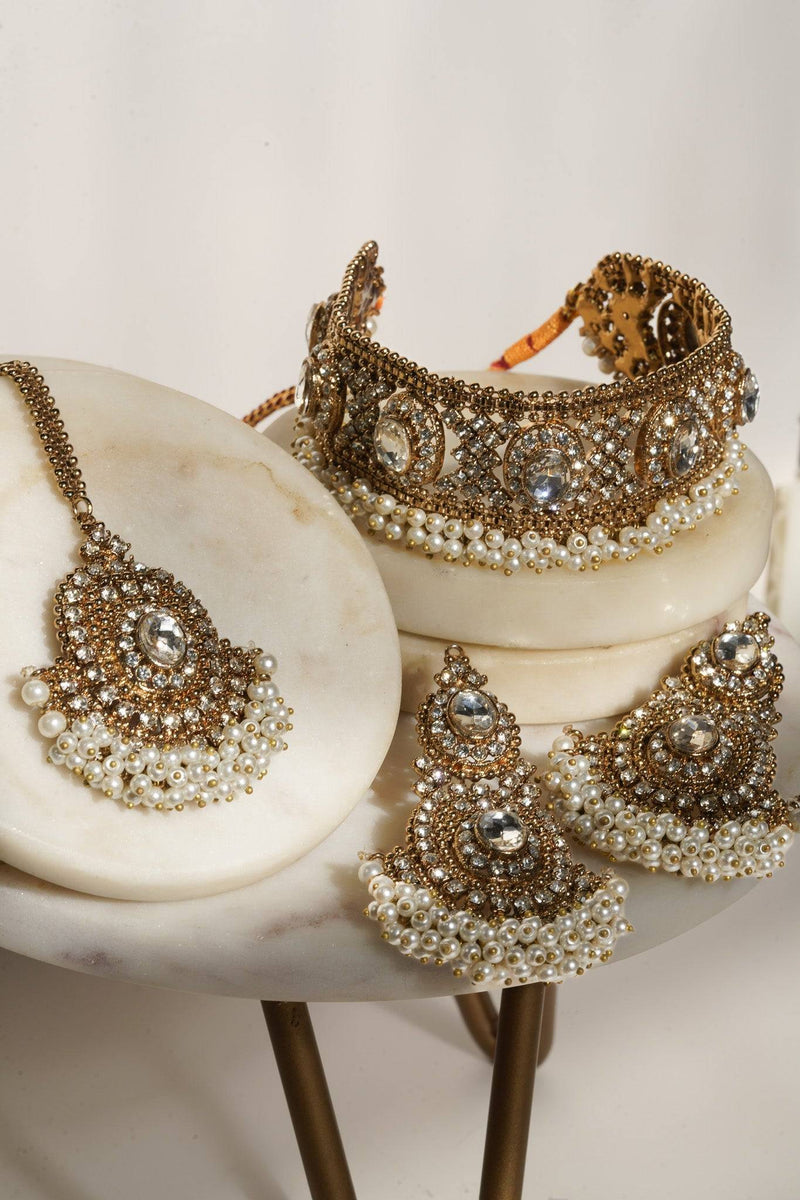 Rimmie Artisan Crafted Choker Set in gold with zircon stones and pearl detailing, includes earrings and pendant for Pakistani jewelry lovers.