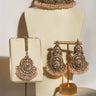Pink gemstone Rimmie Artisan Crafted Choker Set with matching earrings and pendant, displayed on cream jewelry stand.