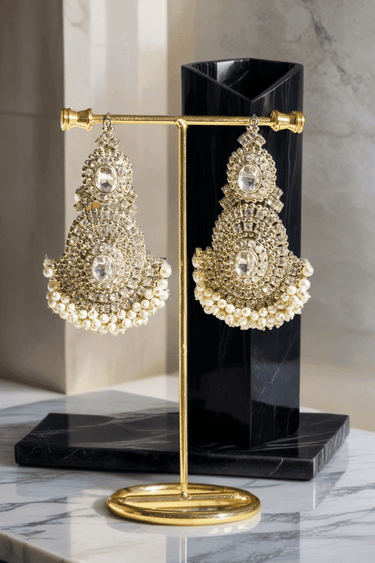 Close-up of Rimmie Artisan Crafted earrings with pearl fringe and zircon stones, part of Pakistani choker necklace set.