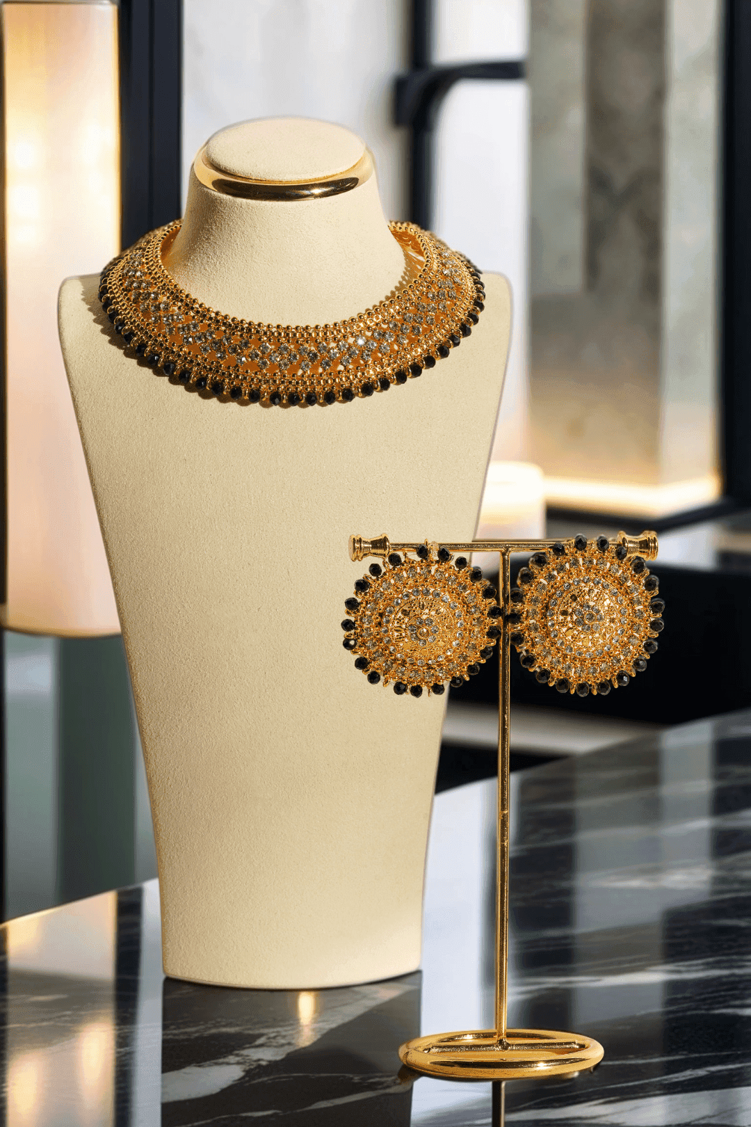 Sabhan Classic Necklace Set - Gold-plated with white zircon stones, available in gold & pearl or gold & black, featuring matching oversized stud earrings.