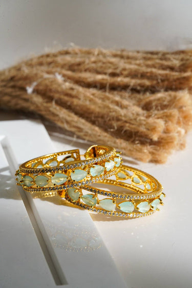 Saira Diamanté Accent AD Hoops - Gold-plated hoop earrings with white or mint green AD stones, measuring 1.54 inches in height and 0.35 inches in width.