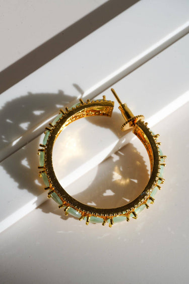 Saira Diamanté Accent AD Hoops - Gold-plated hoop earrings with white or mint green AD stones, measuring 1.54 inches in height and 0.35 inches in width.