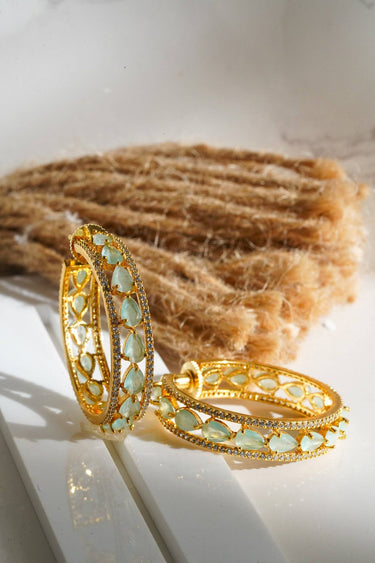Saira Diamanté Accent AD Hoops - Gold-plated hoop earrings with white or mint green AD stones, measuring 1.54 inches in height and 0.35 inches in width.