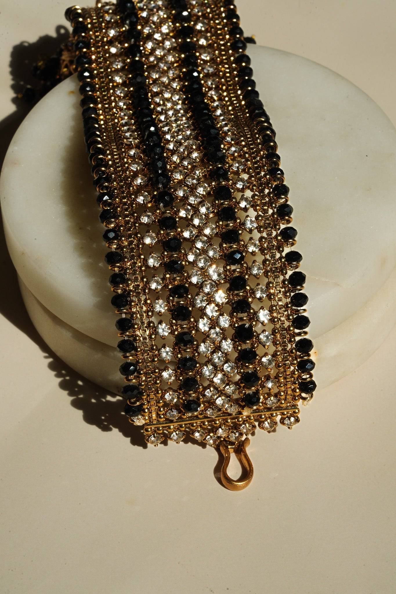Hook clasp and end detail of Samia Bangles with black beads and CZ stones, emphasizing secure fit and artisan quality.
