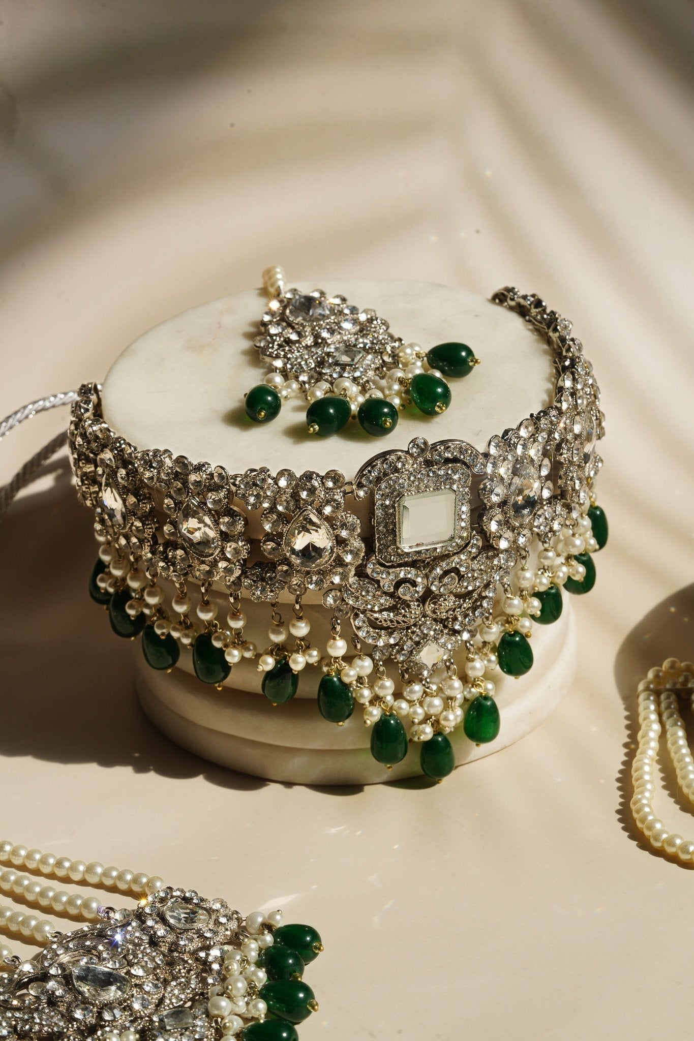 Sareena - Silver and Green Necklace Set with Earrings, Maang Tikka and Jhoomer Optional Choker Necklace Set from Inaury
