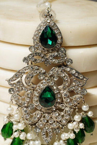 Upper section of Sidra Dangler Earrings in silver with green teardrop CZ stones and ornate filigree, part of Pakistani Jewelry collection.