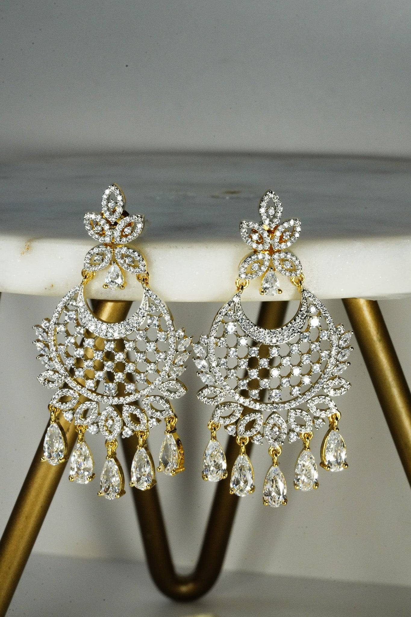 Siya AD Chandbali Earrings - Available in rhodium or gold plating with white AD stones, featuring a 2.5-inch drop, perfect for a statement piece.