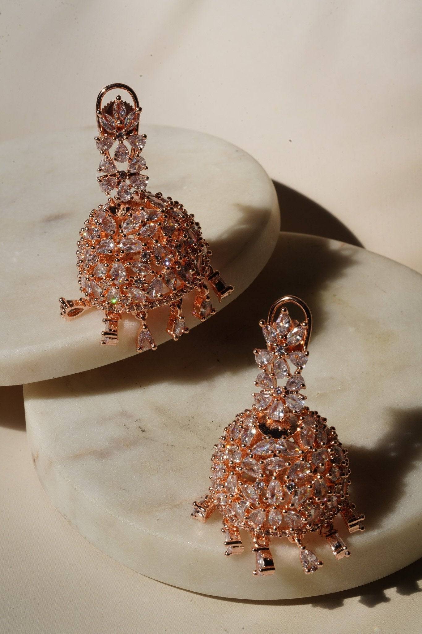 Sneha Floral Jhumka Earrings - Rhodium or rose gold plated, featuring a detailed floral print design, perfect for Western and Indian attire.