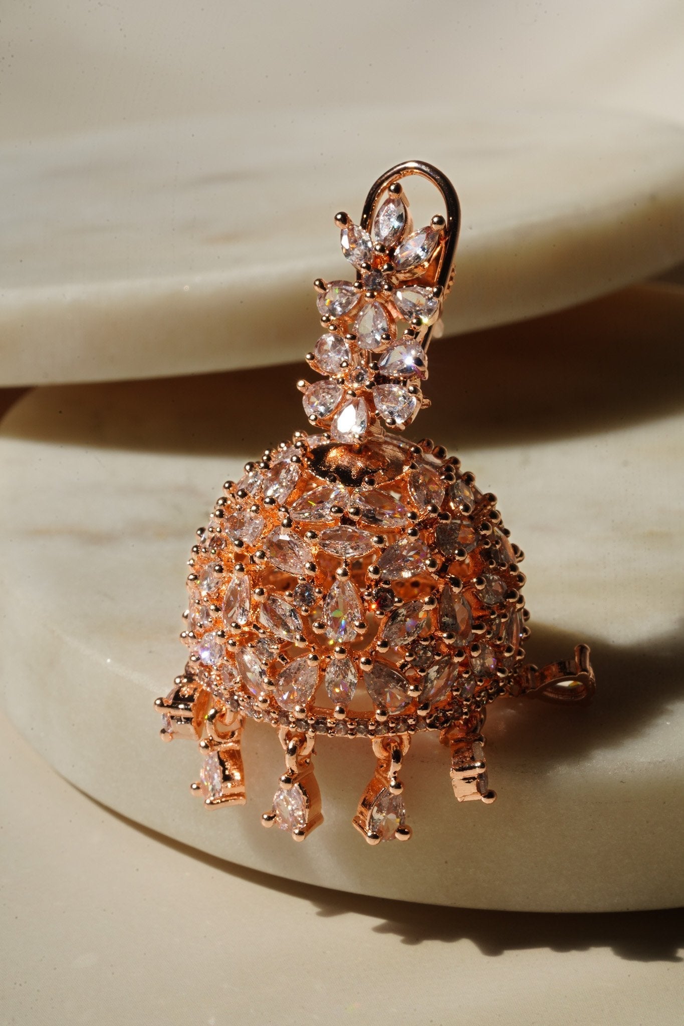 Sneha Floral Jhumka Earrings - Rhodium or rose gold plated, featuring a detailed floral print design, perfect for Western and Indian attire.