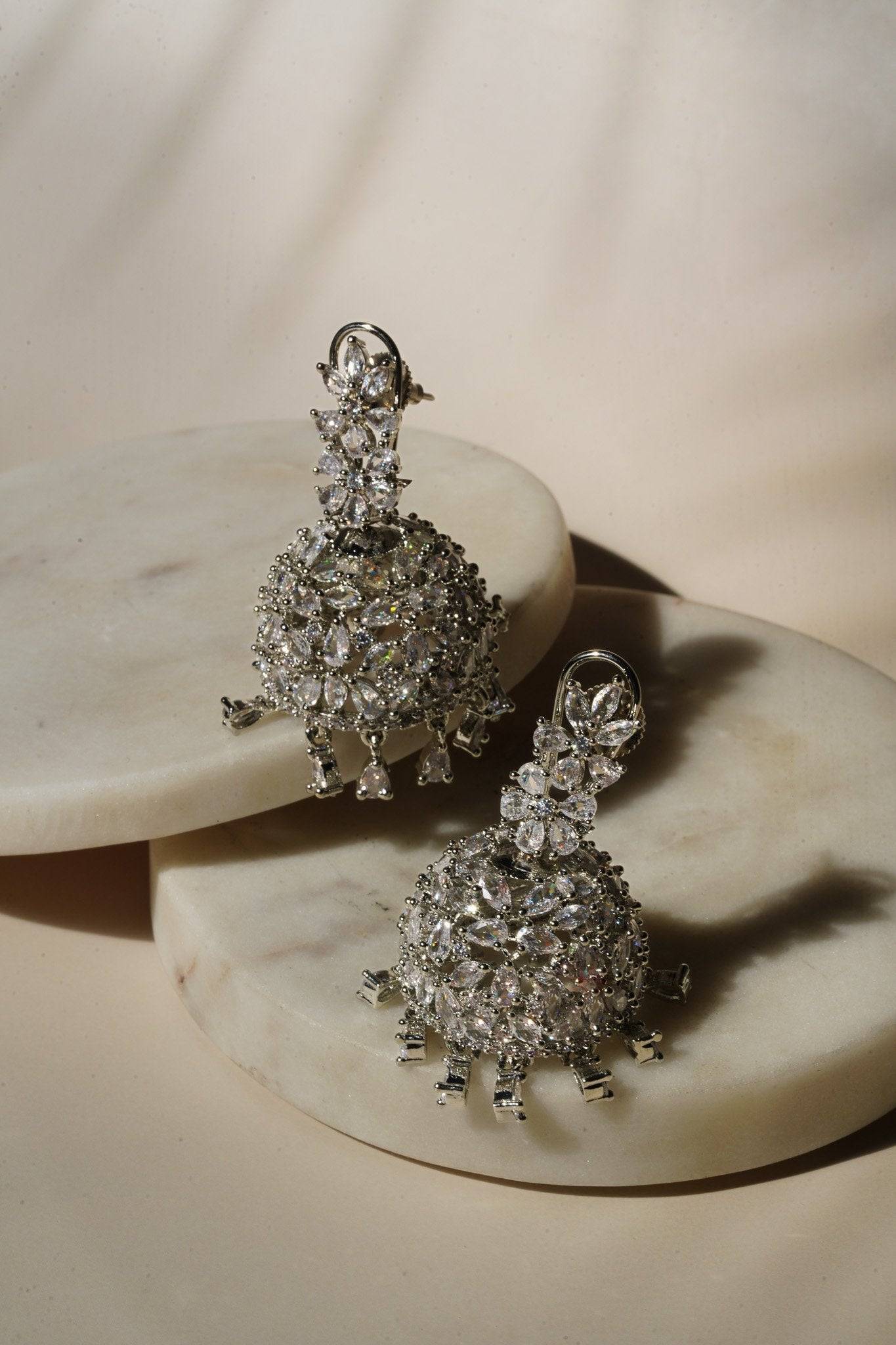 Sneha Floral Jhumka Earrings - Rhodium or rose gold plated, featuring a detailed floral print design, perfect for Western and Indian attire.