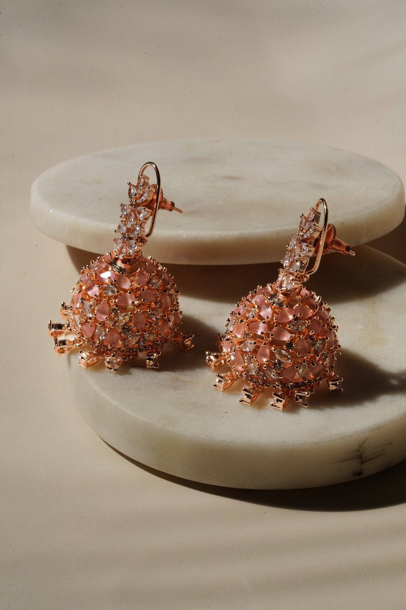 Sneha Floral Jhumka Earrings - Rhodium or rose gold plated, featuring a detailed floral print design, perfect for Western and Indian attire.