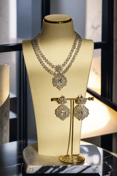 Zeenat Double Layer Diamanté Accent Necklace Set - Rhodium-plated silver finish with intricate detail-cut stones, available in four colors: sapphire blue, emerald green, white, and ruby. Includes matching statement earrings.